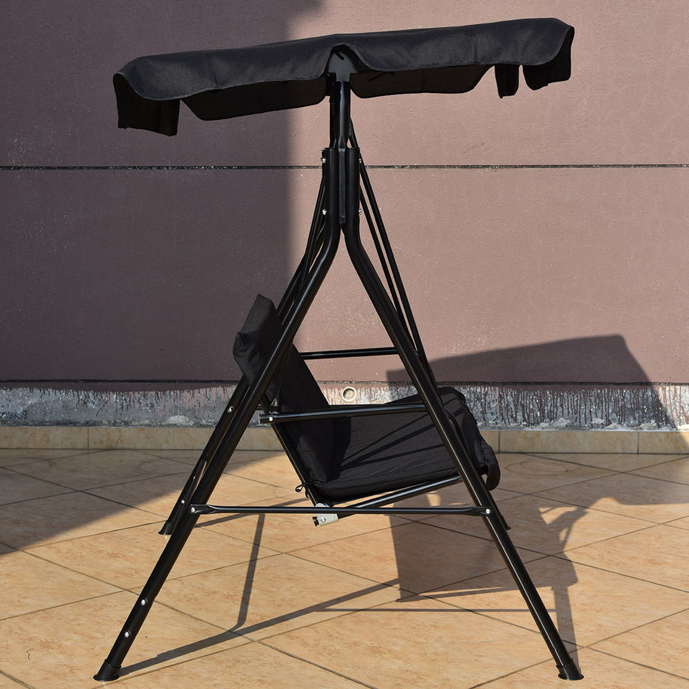 Black steel frame loveseat swing glider with waterproof canopy and cushioned seats for outdoor relaxation.
