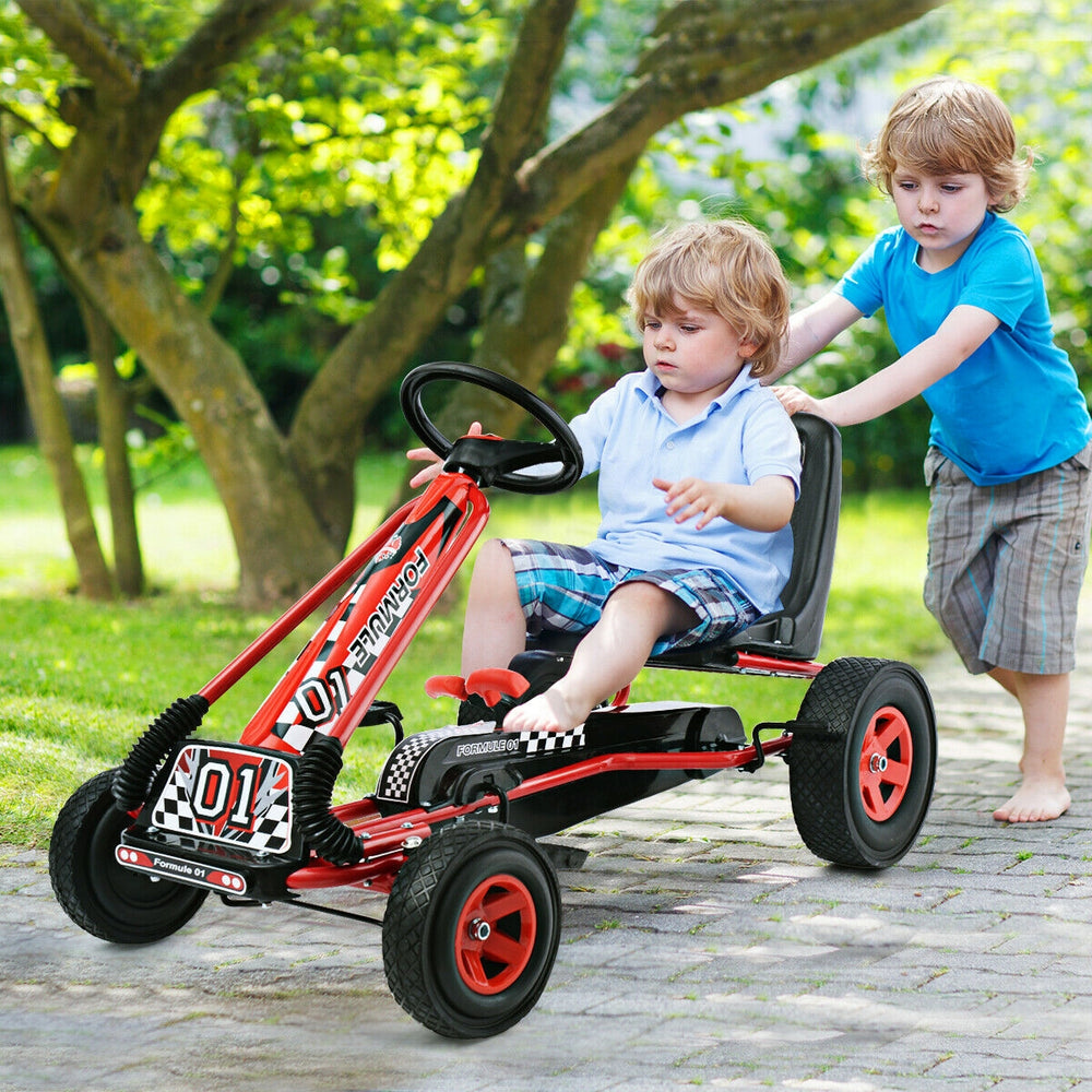 Kids pedal-powered go-kart in red with four rubber wheels, suitable for ages 3-8, for outdoor play and stability.