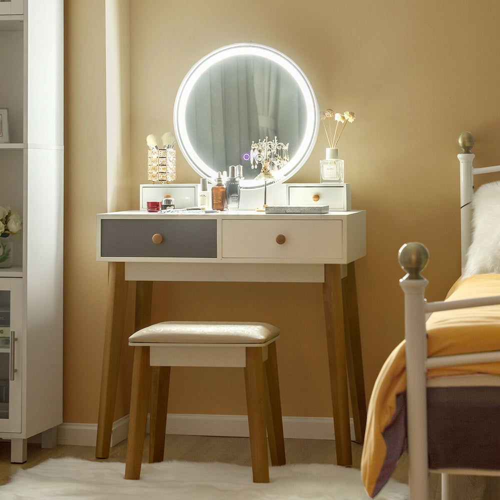 Makeup dressing table with lighted round mirror, 4 drawers, and solid beech wood legs for elegant bedroom decor.