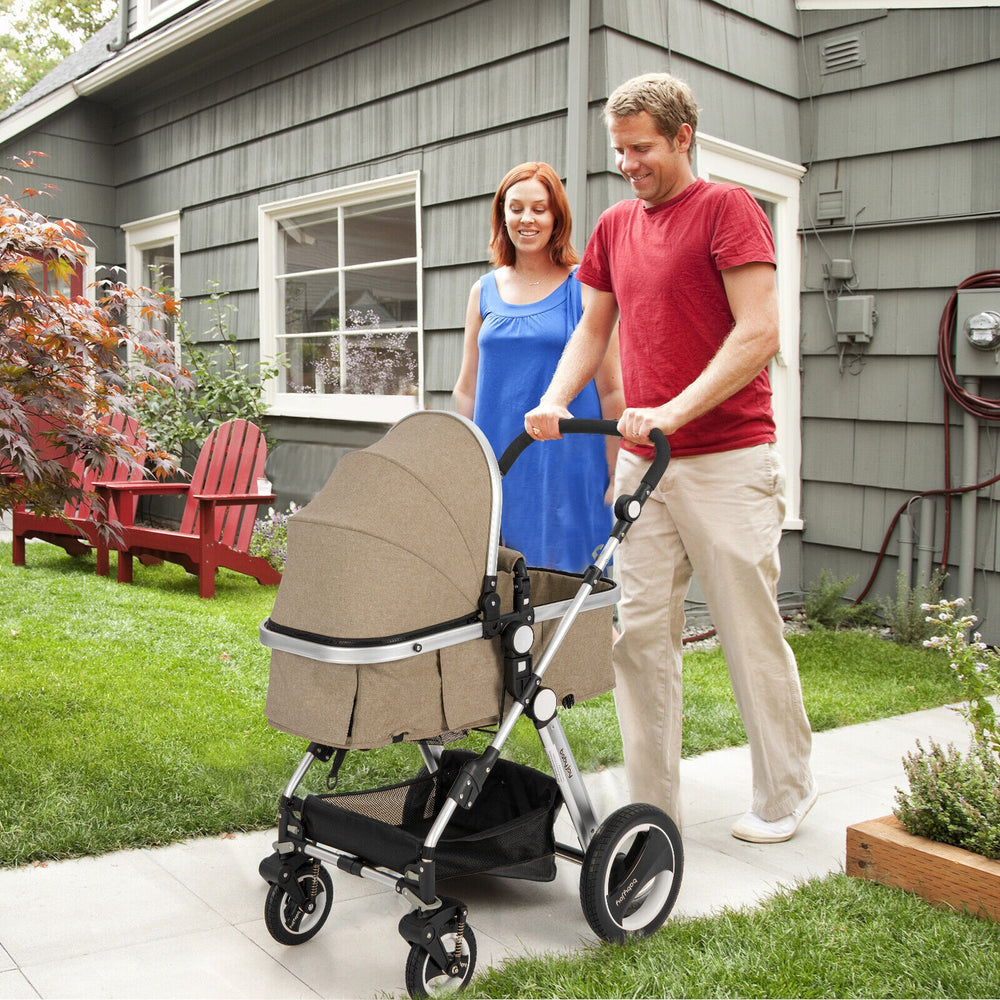 Beige folding aluminum baby stroller with adjustable canopy and storage basket, suitable for infants and toddlers.