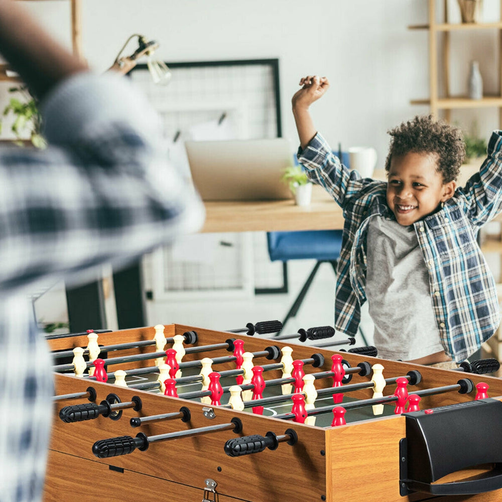 Child celebrating a goal at the 48-inch 3-in-1 multi combo game table for soccer, billiards, and hockey.