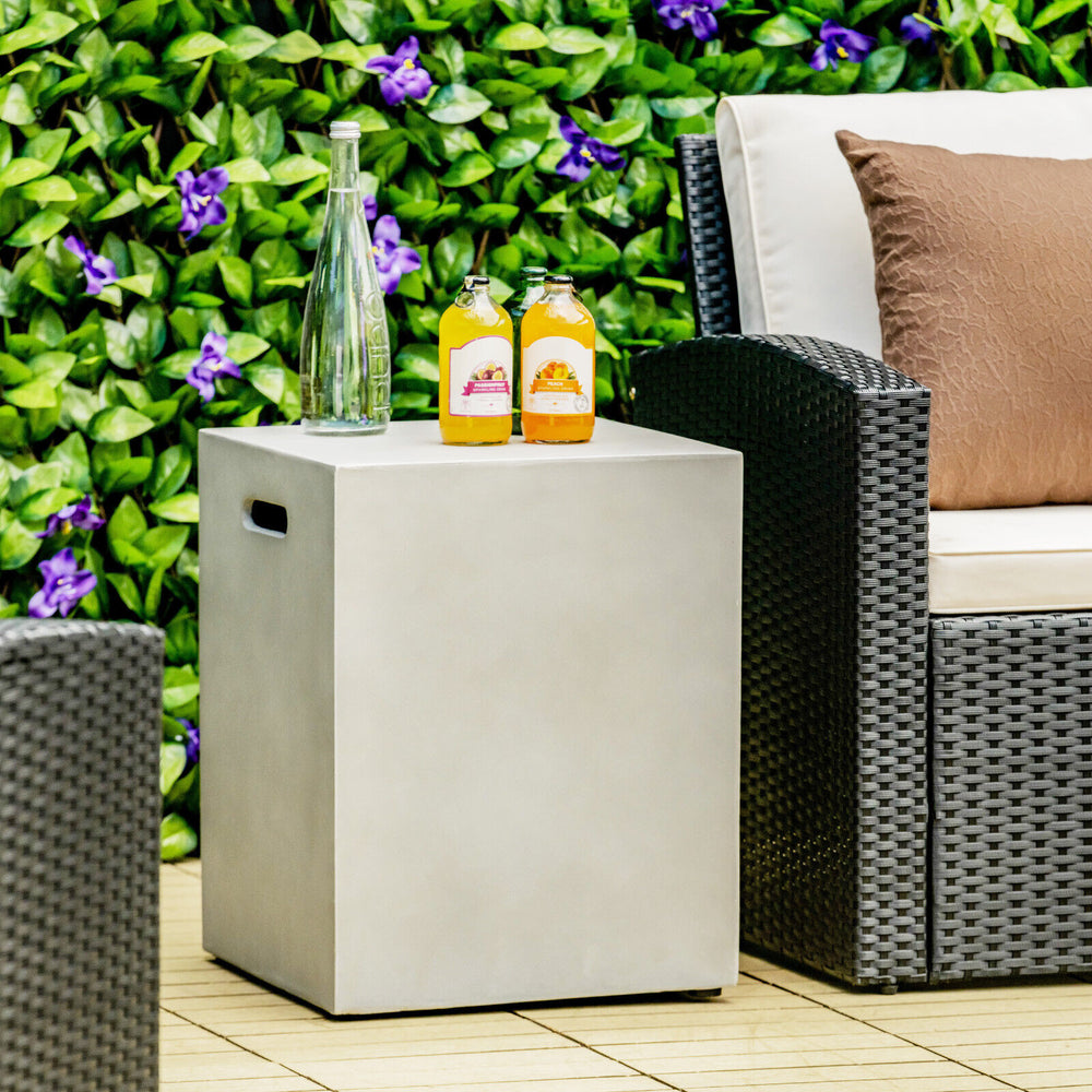 Gray propane tank cover hideaway table with drinks, ideal for outdoor use in garden or patio settings.