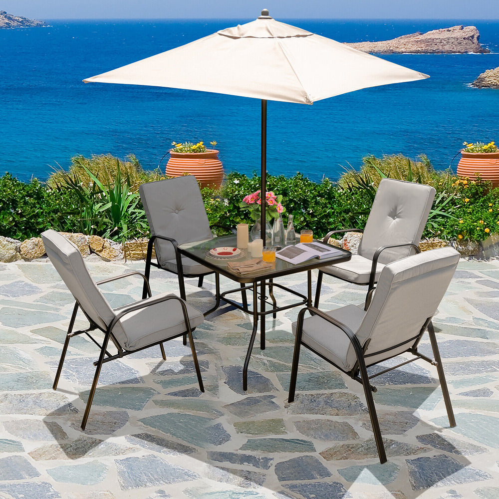 Four stackable patio dining chairs with high-back cushions, ideal for outdoor relaxation by the poolside.