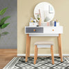 Makeup dressing table with round mirror, 4 drawers, and solid beech wood legs, perfect for bedroom or living room use.