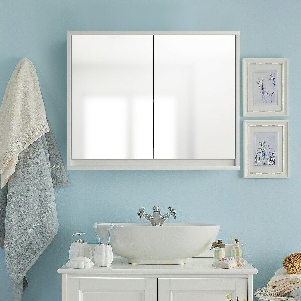 Wall-mounted 2-door mirrored medicine cabinet in a bathroom setting, featuring elegant design and space-saving storage.