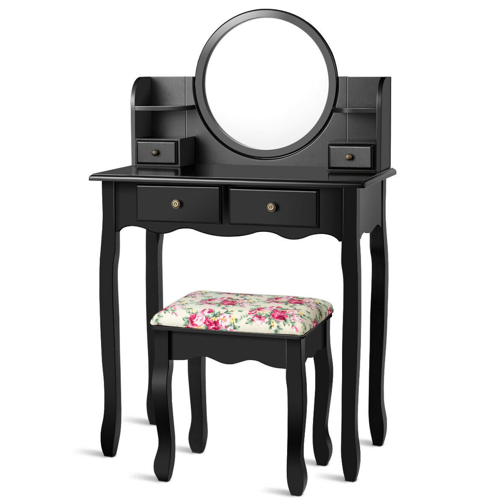 Black makeup vanity table set with oval mirror, 4 drawers, and cushioned stool, perfect for girls' dressing needs.