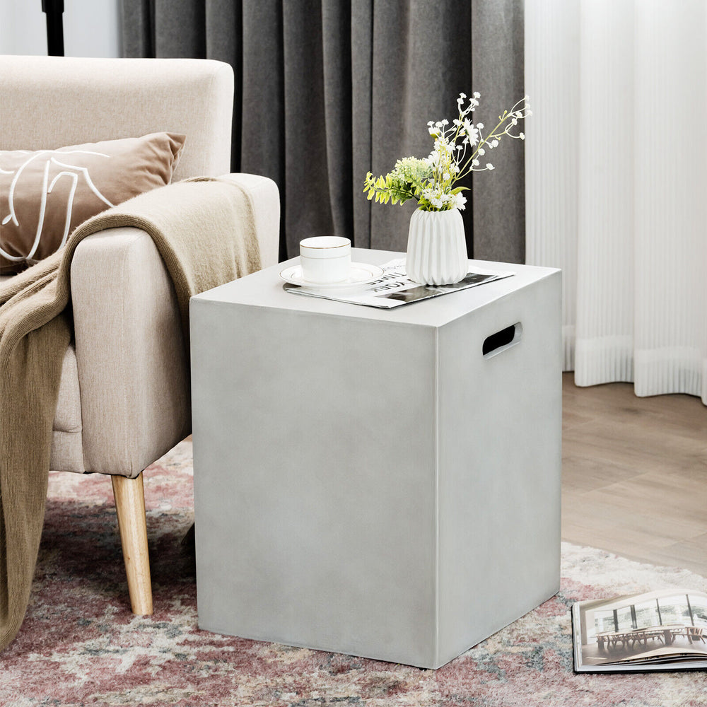 Gray propane tank cover hideaway table with handles, designed for outdoor use as a side table in garden or patio.