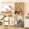 Bamboo over-the-toilet storage cabinet with adjustable shelf, anti-tipping device, and louvered doors for ventilation.