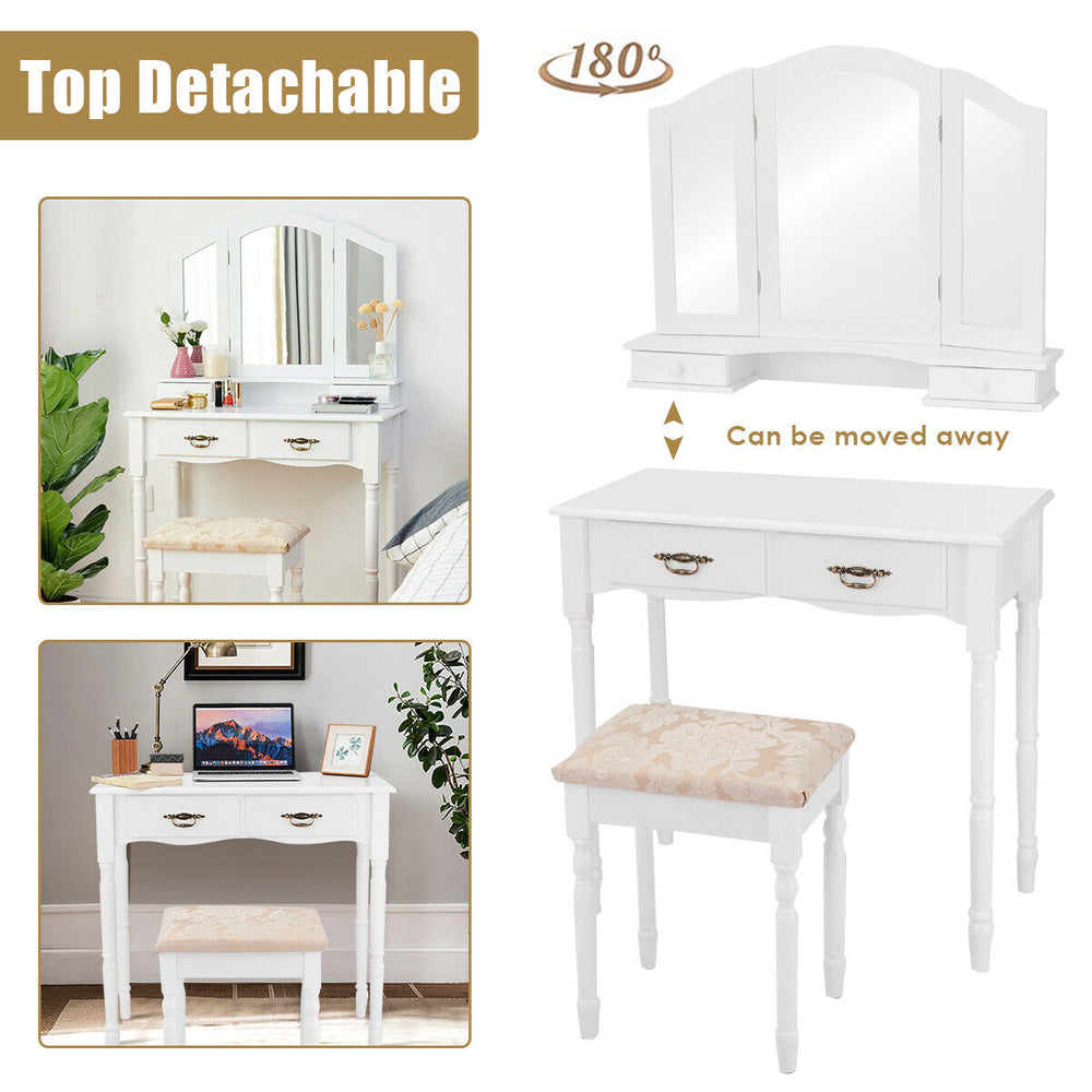 White vanity set with tri-fold mirror, four storage drawers, and cushioned stool for comfortable makeup application.