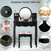Black makeup vanity table set with oval mirror, 4 drawers, and cushioned stool for stylish and functional dressing.