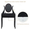 Elegant black vanity table set with lighted mirror, cushioned stool, and anti-tipping hardware for safe use.