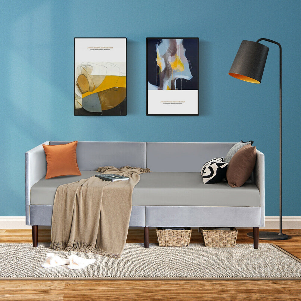 Twin size daybed frame in gray velvet with wooden slat support, ideal for small spaces and versatile use as a bed or.