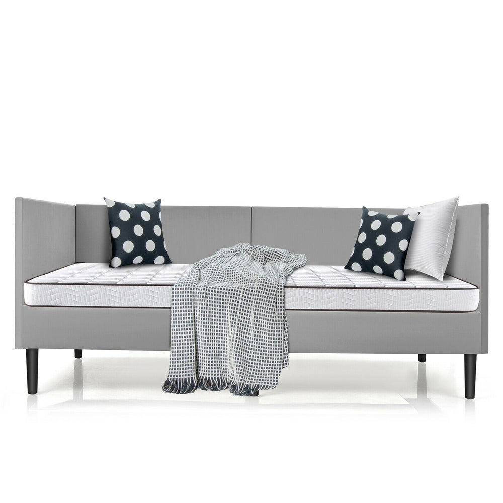 Twin size daybed frame in gray with modern design, featuring soft velvet fabric and stylish accent pillows for comfort.