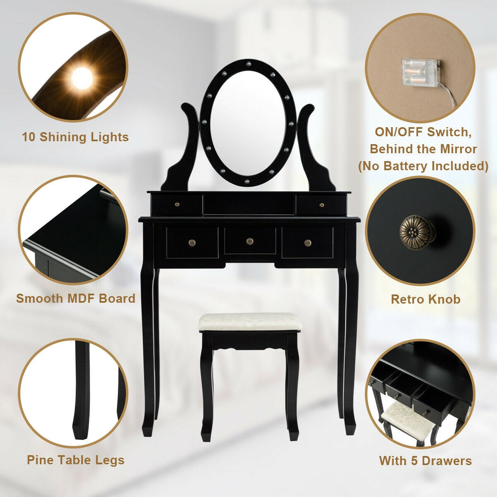 Vanity table set with oval mirror, 12 LED bulbs, and 5 drawers in black, perfect for makeup or writing use.