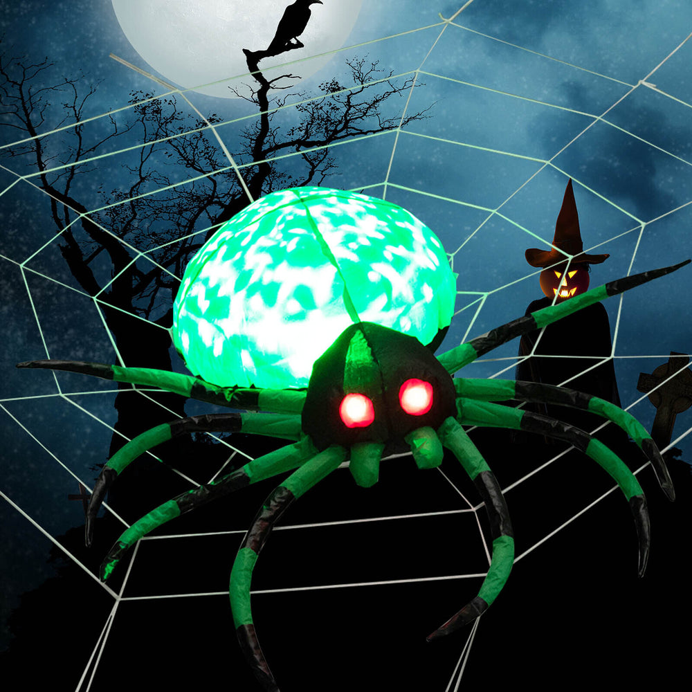 5-foot Halloween inflatable spider with glowing green body, red eyes, and cobweb, perfect for festive outdoor decor.