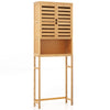 Bamboo over-the-toilet storage cabinet with double louvered doors and adjustable shelf for bathroom organization.
