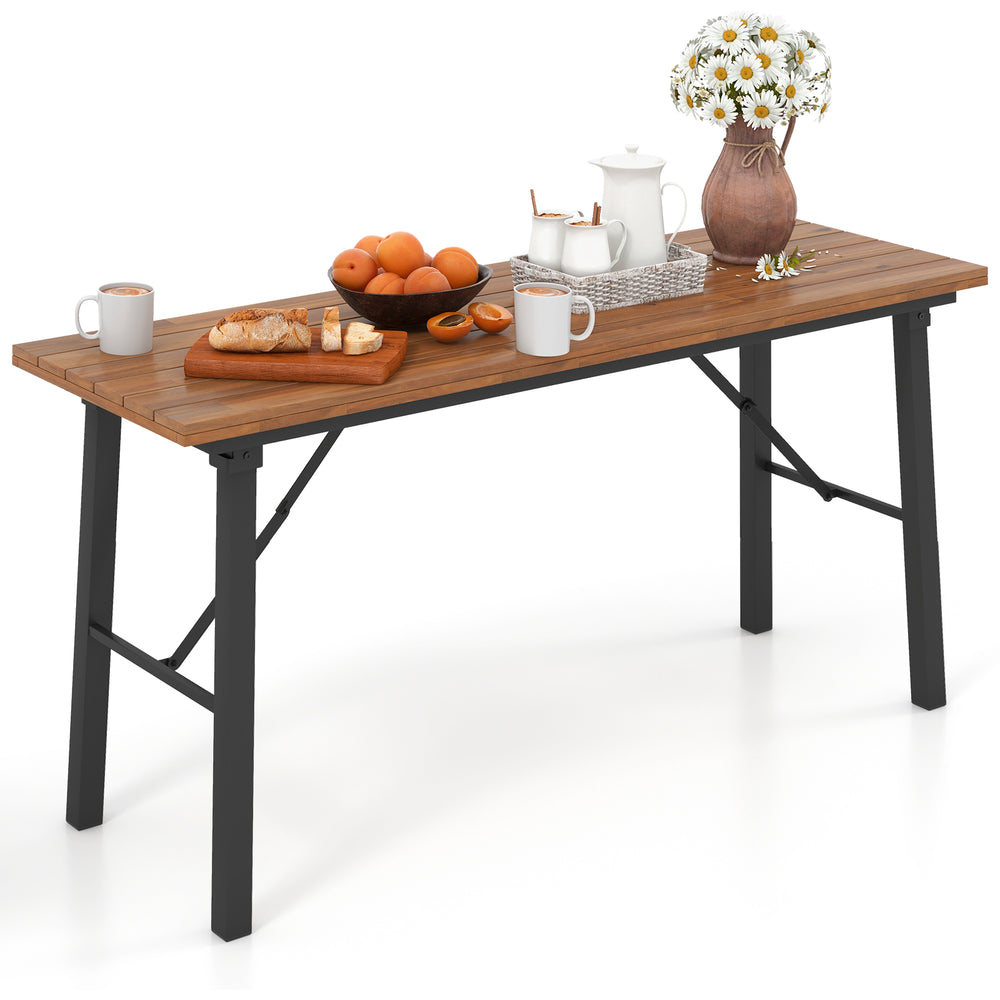 Outdoor dining table with acacia wood top, featuring a sturdy metal frame, ideal for yard and poolside gatherings.