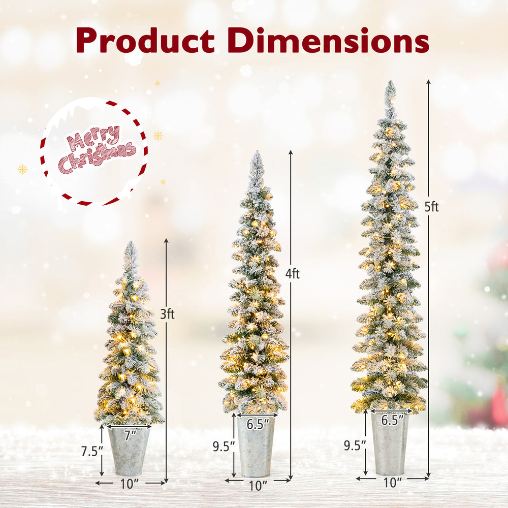 Set of 3 pre-lit snow flocked artificial Christmas trees in varying heights with warm white LED lights for festive.