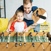 Wooden foosball table with textured handles, featuring 22 players and a spacious green court for home recreation.