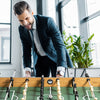 Competition-sized 48" wooden foosball table with sturdy legs and non-slip handles, perfect for game rooms and offices.