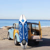 6 feet surfboard with blue design and detachable fins, ideal for beginners, placed on a vintage car at the beach.