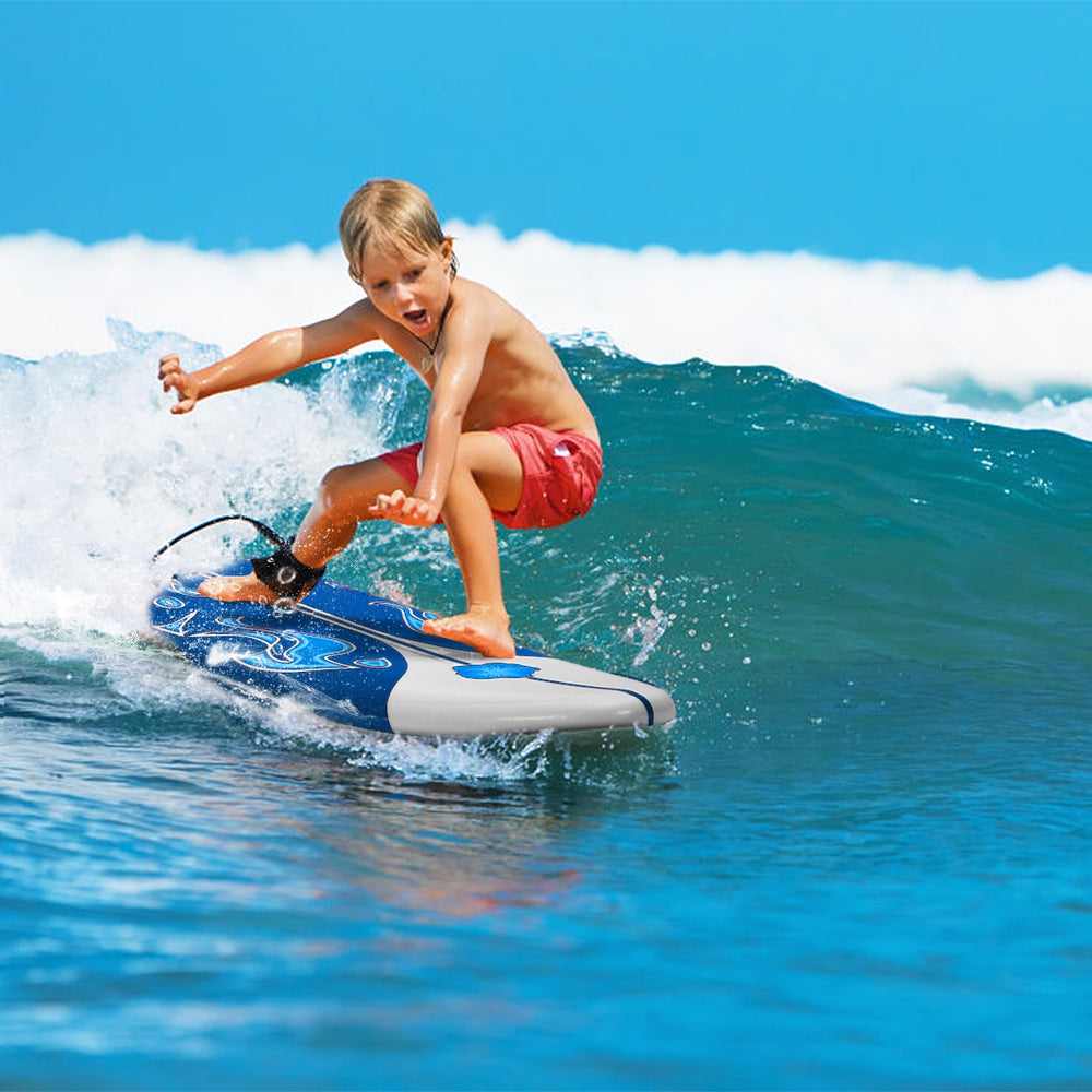 Child surfing on a 6 feet surfboard with a durable foam top and detachable fins, perfect for beginners.