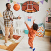 Indoor basketball game featuring a large shatter-proof backboard, perfect for family fun and skill improvement.