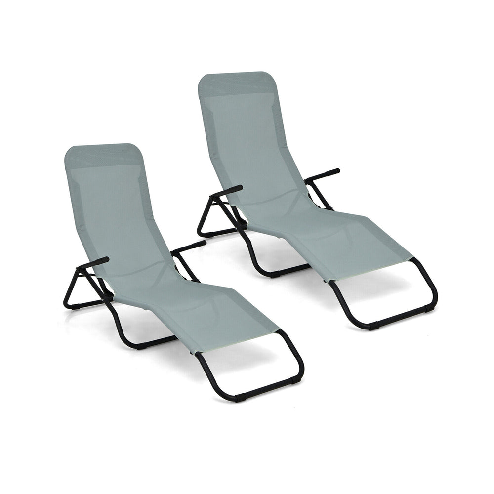 Two light green folding patio chaise loungers with rocking design, ergonomic backrest, and sturdy steel frame for.