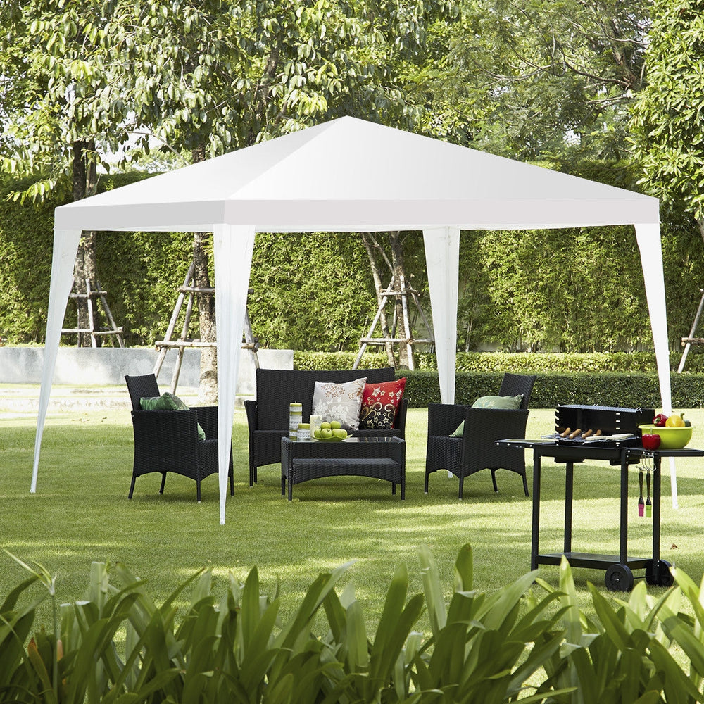 10 x 10 feet outdoor wedding canopy tent set up in a backyard, providing shade for seating and dining areas during.