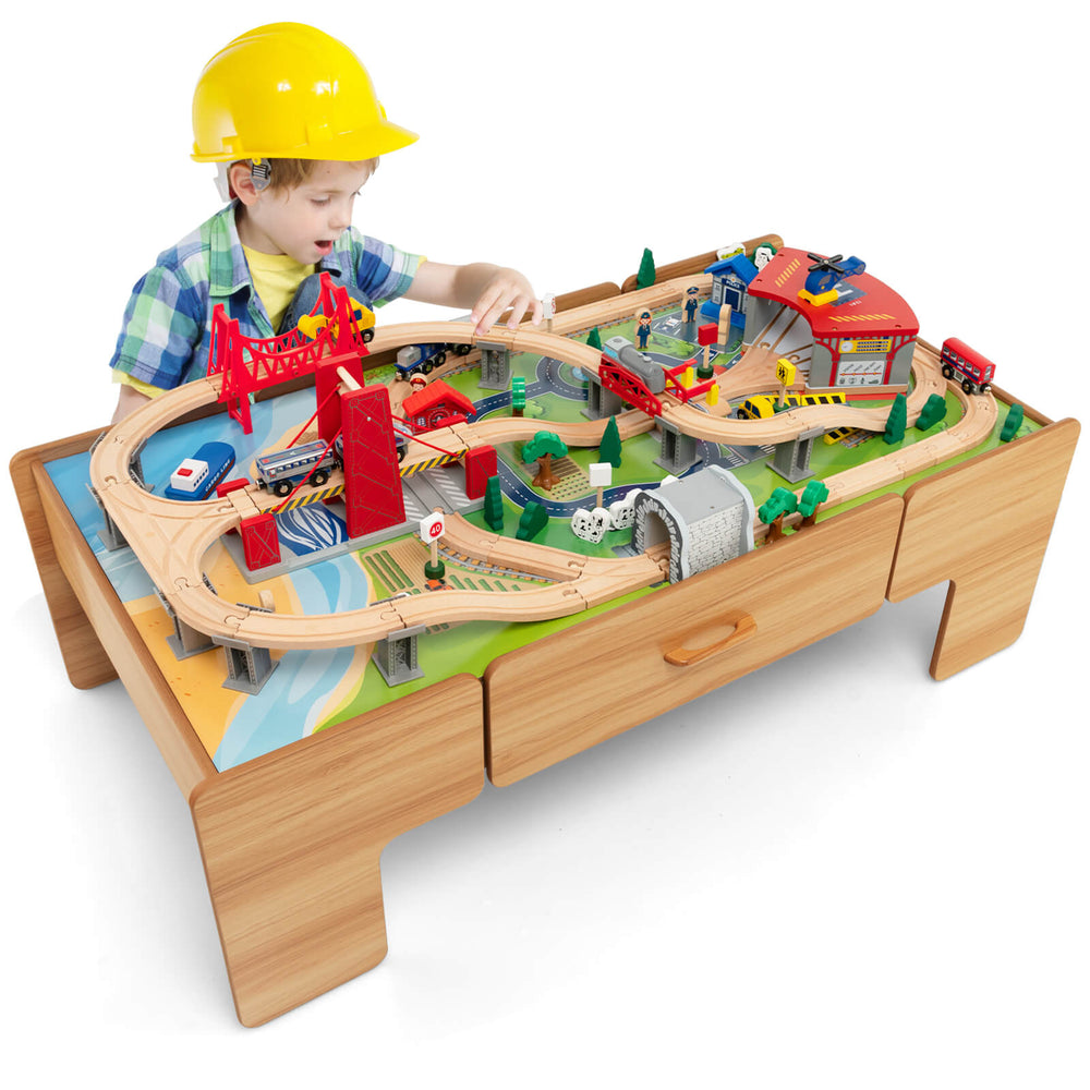 Wooden train set table with 100 pieces, featuring a reversible design and storage drawer for imaginative play.