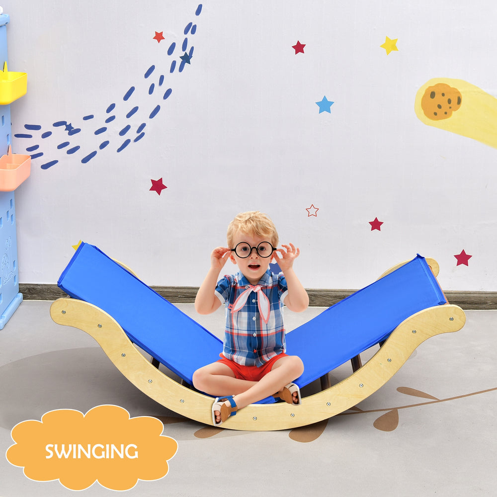 Kids wooden arch triangle rocker climber set with blue mat, promoting balance and imagination for indoor play.