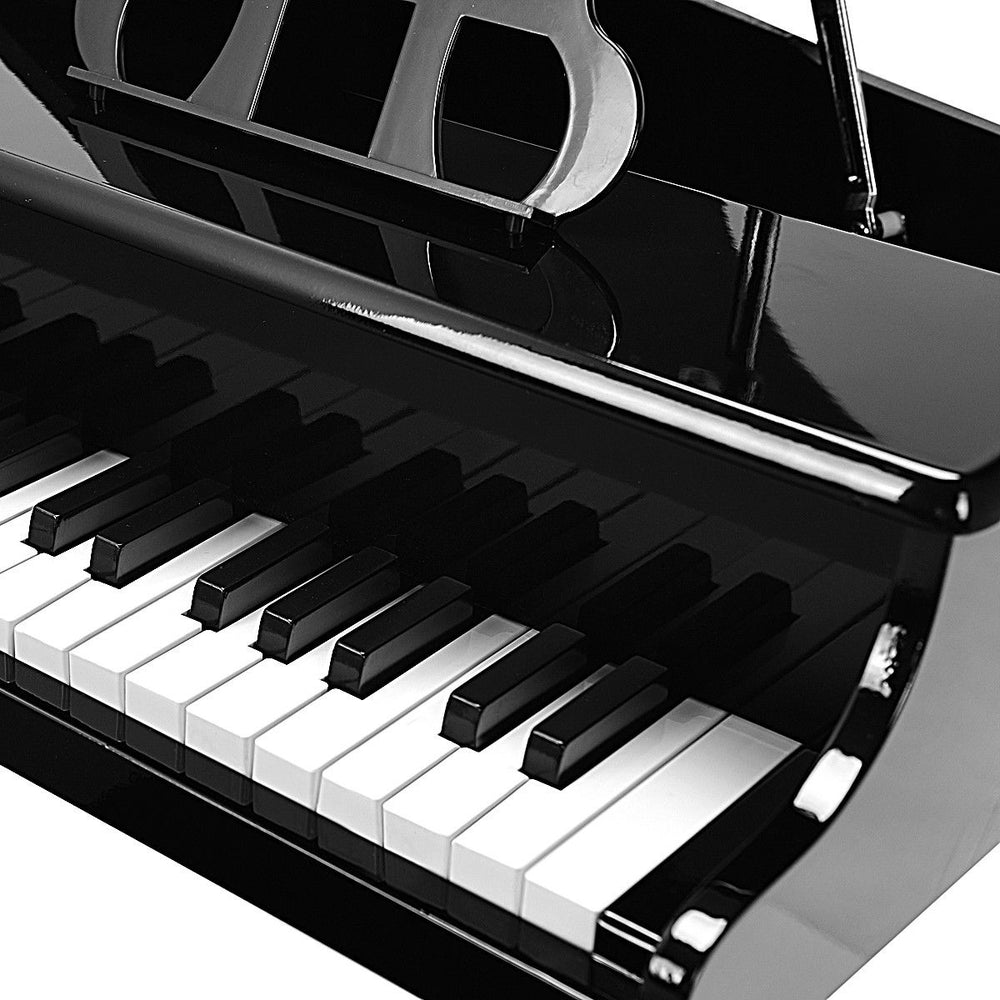 Mini grand piano with 30 keys in black finish, includes matching bench and music score holder for children aged 1 to 7.