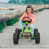 Child enjoying a green 4 wheel pedal powered ride-on with adjustable seat, navigating a path with non-slip wheels.