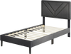 Upholstered twin platform bed with tufted headboard and wooden slats, featuring a sleek design and no box spring needed.