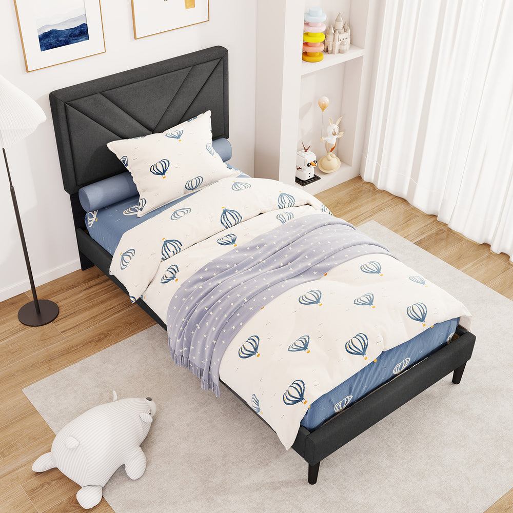 Upholstered twin platform bed with tufted headboard, faux linen fabric, and wooden slats in a modern bedroom setting.