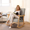 Upholstered rocking chair in gray with rubber wood frame, perfect for reading and relaxing in any room.