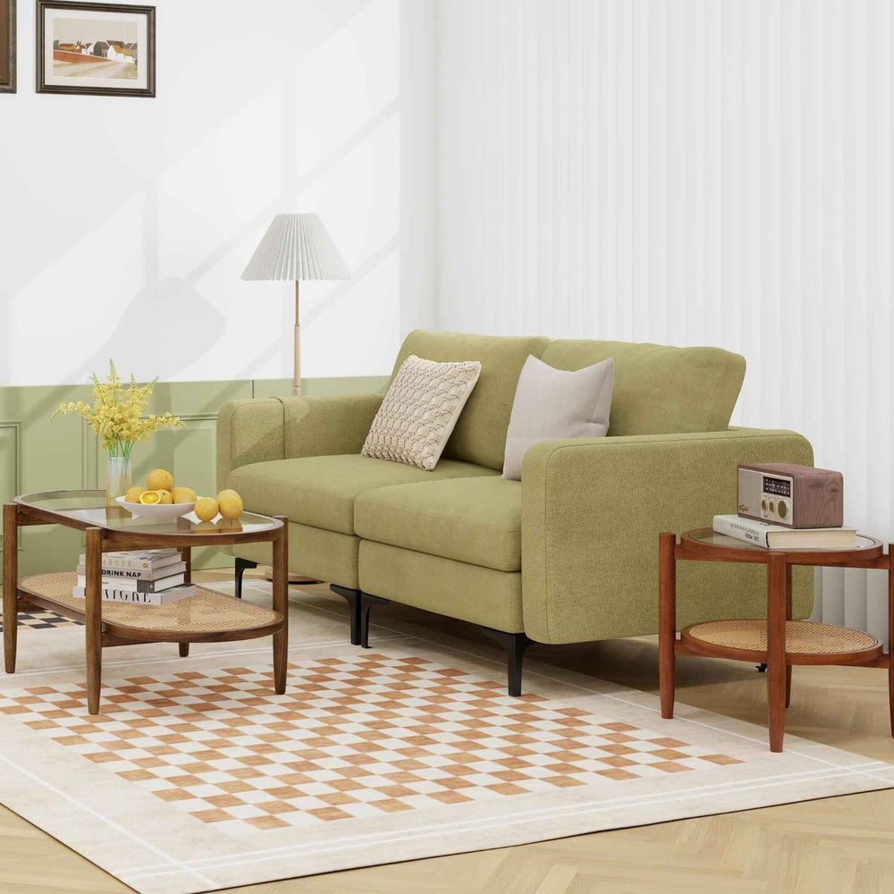 Modern green sofa with ergonomic backrest and high-density cushions, ideal for cozy living room seating.