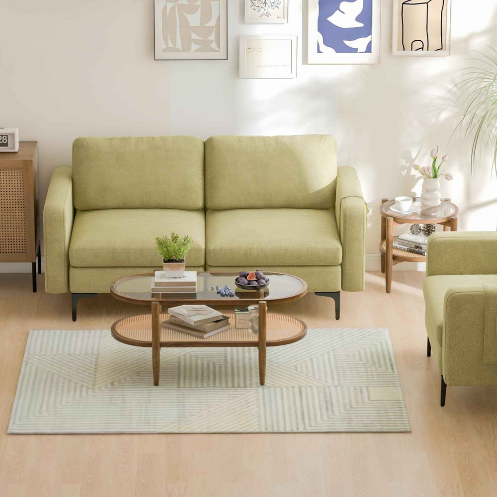 Modern living room furniture set featuring a cozy green sofa, coffee table, and stylish side table for versatile decor.