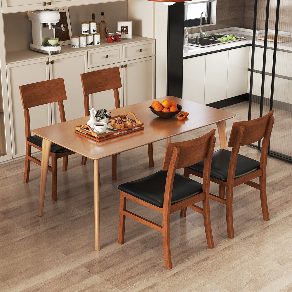 Set of 2 dining chairs with rubber wood legs and black faux leather upholstery, perfect for kitchen or dining room use.