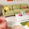 Modular L-shaped sectional sofa in green with accent chair and LED coffee table, perfect for stylish living room decor.