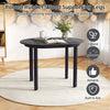 Detail of the sturdy rubber wood legs and smooth tabletop of the 43-inch black dining table, perfect for small spaces.