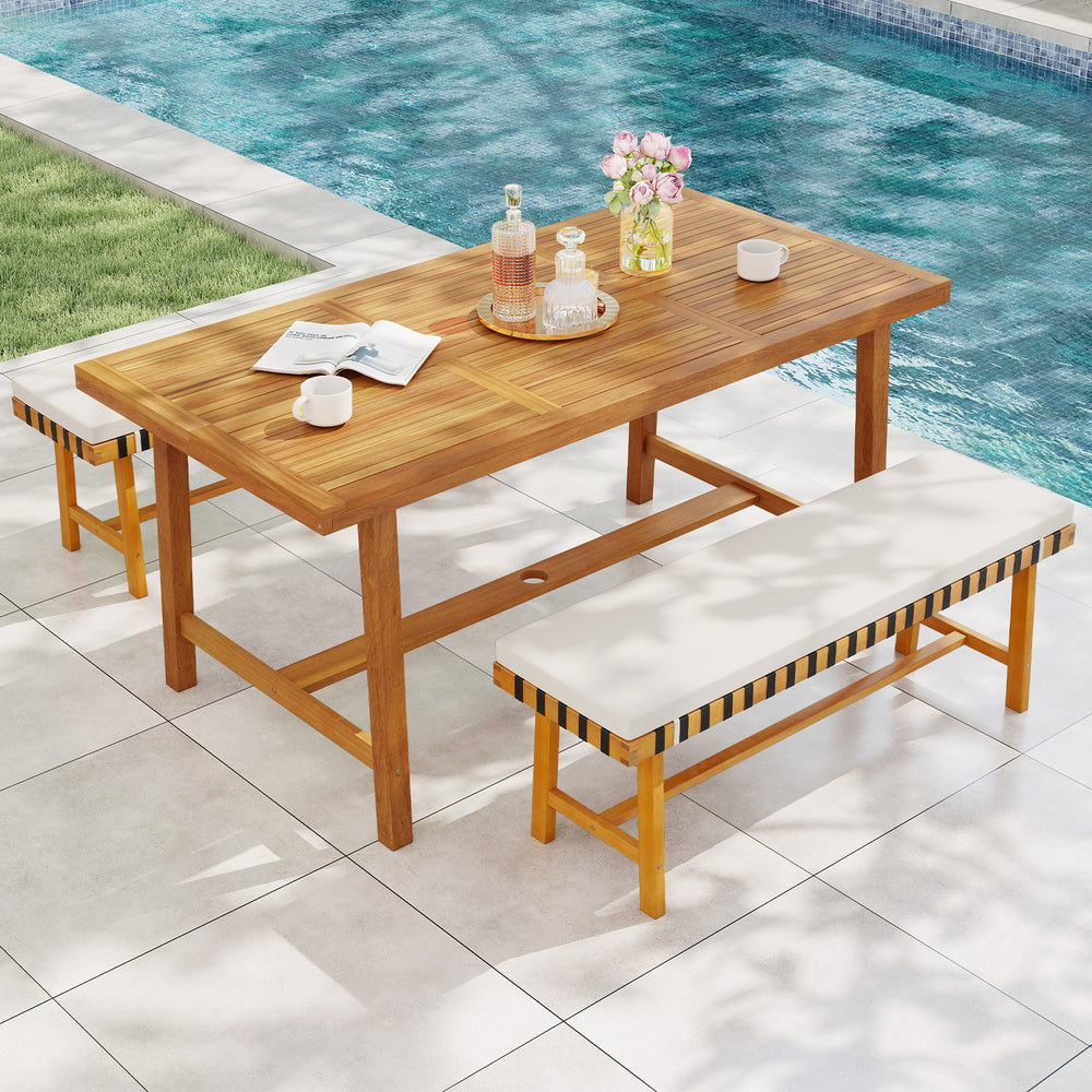 3-piece patio dining set featuring a solid acacia wood table and two benches with cushions, perfect for outdoor.