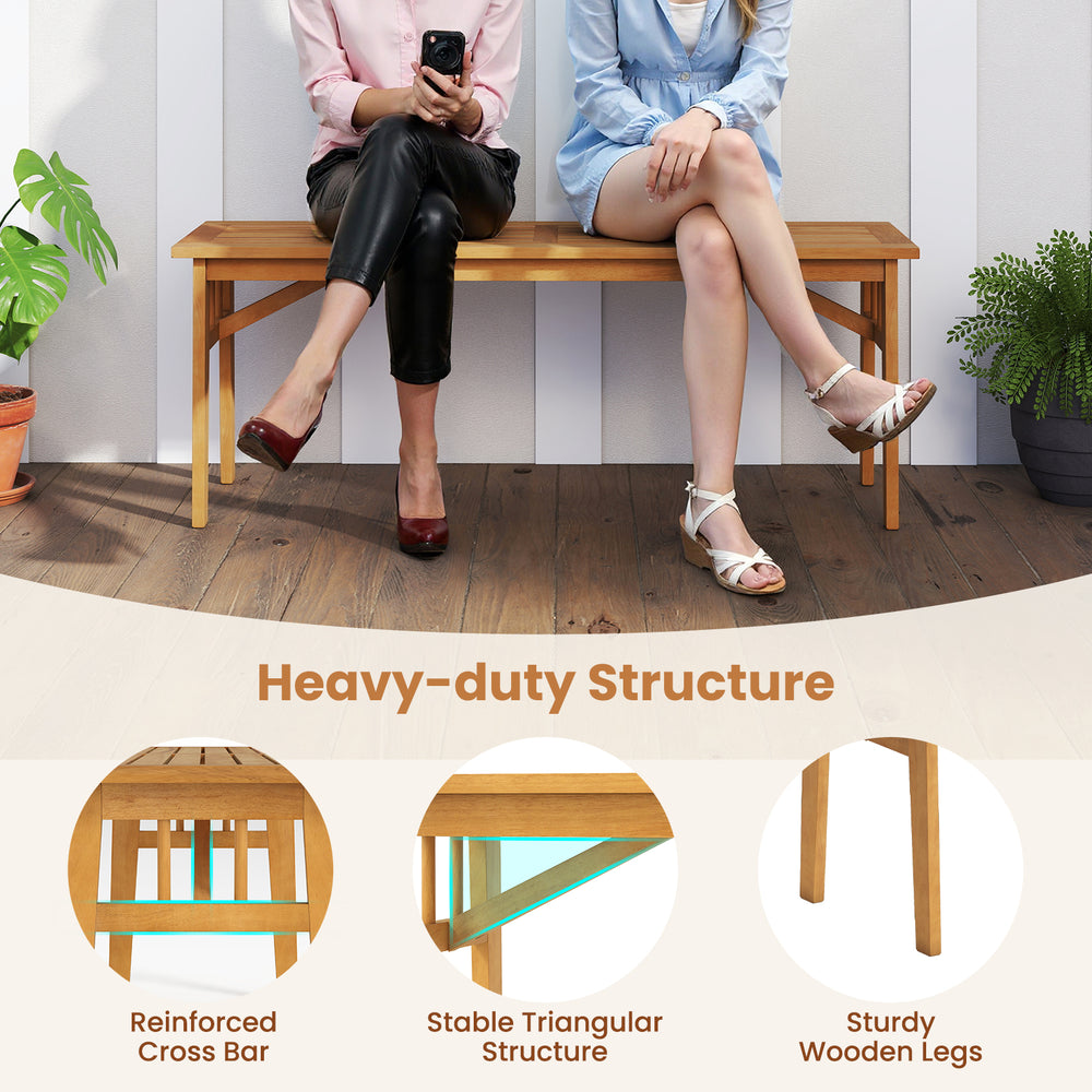 Two people seated on a sturdy acacia wood bench from a patio dining set, showcasing its heavy-duty structure and rustic.