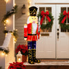 5 FT Christmas nutcracker decoration with glitter sword, illuminated by 100 warm-white LED lights for festive outdoor.