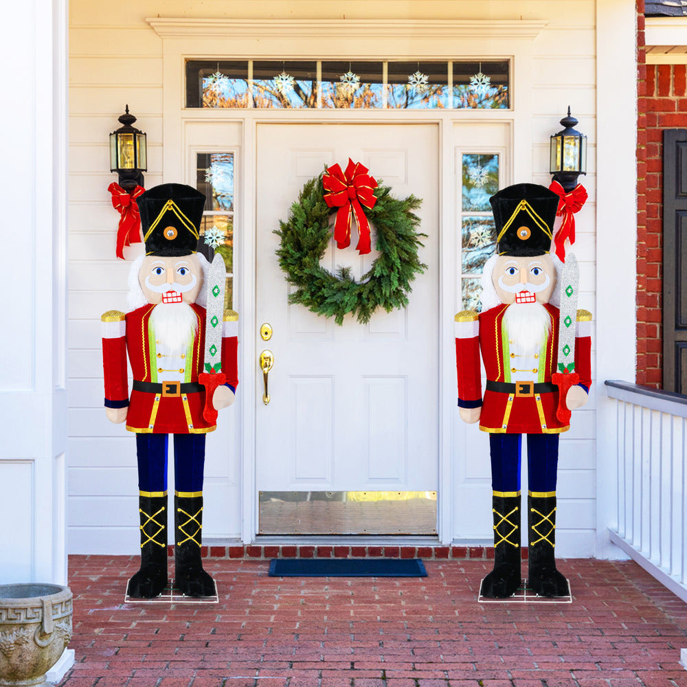 Set of 2 5 FT Christmas nutcracker decorations with glitter swords, featuring warm-white LED lights for festive outdoor.
