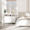 Nightstand with drawer and shelf alongside a large two-door cabinet, featuring an elegant curved design for stylish.