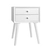 White nightstand with two drawers, part of a children's room furniture set, perfect for organizing toys and essentials.