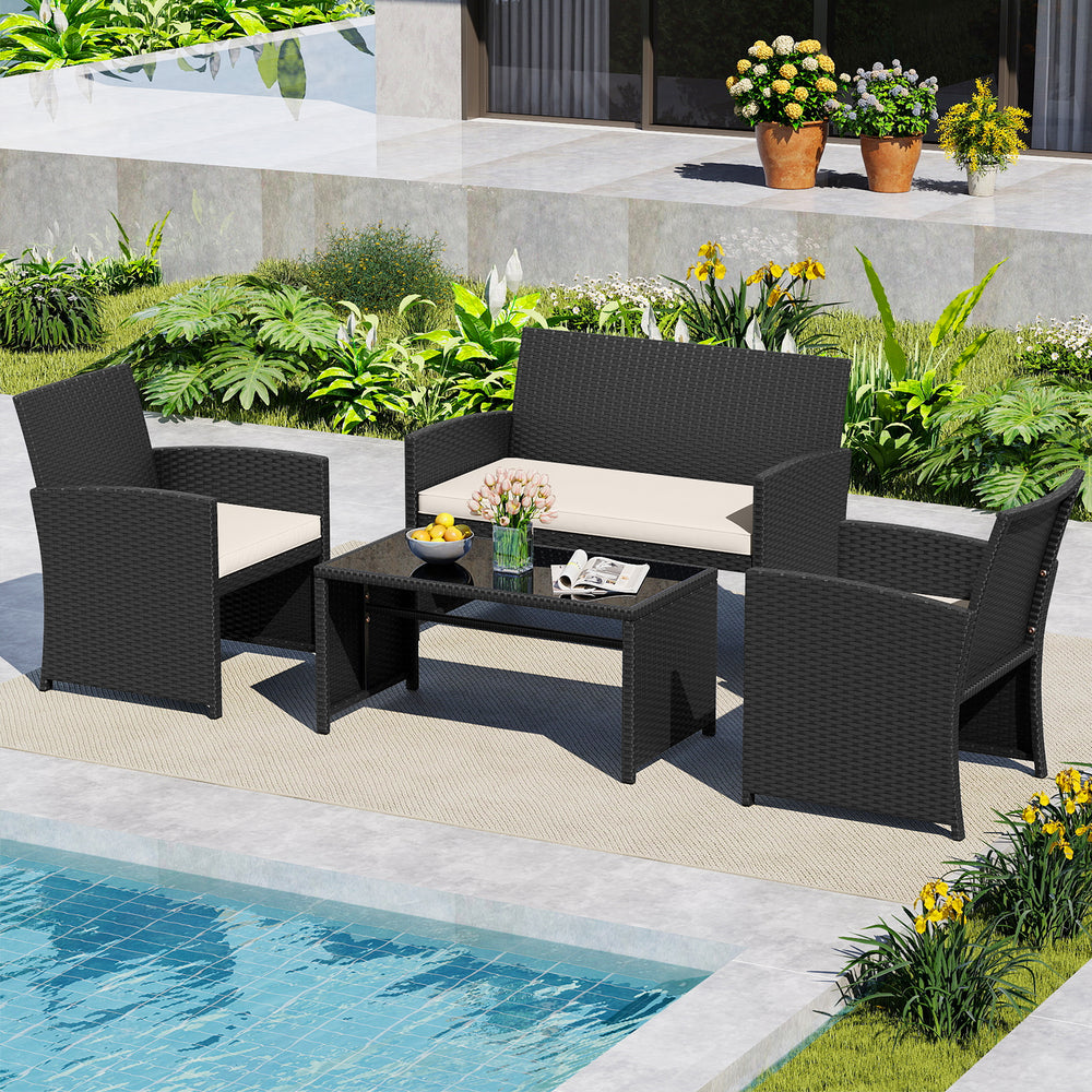 4-piece patio furniture set with removable white cushions, waterproof rattan, and tempered glass tabletop for outdoor.