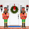 Set of 2 lighted 5 FT Christmas nutcrackers with glitter swords, featuring 100 warm-white LED lights for festive.