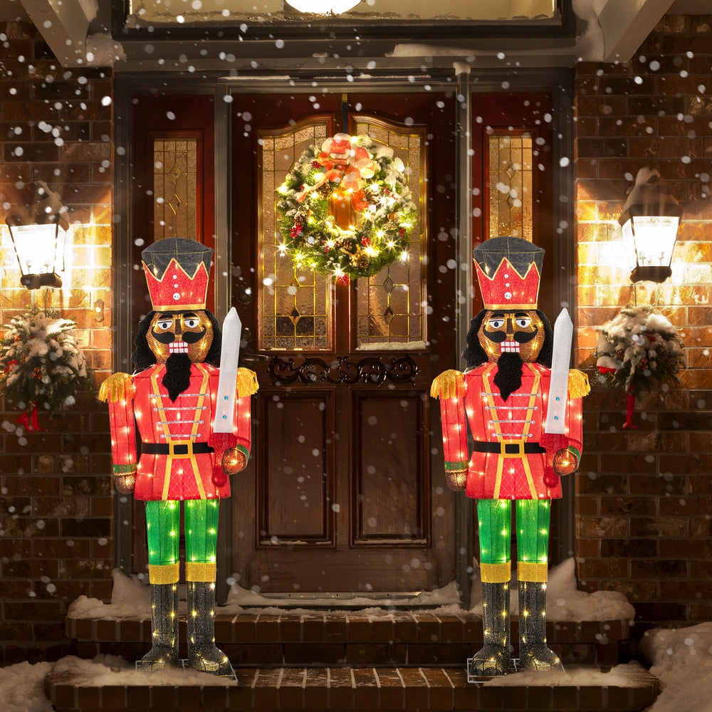 5 FT lighted Christmas nutcracker with tall hat and glitter sword, showcasing festive colors for outdoor holiday.